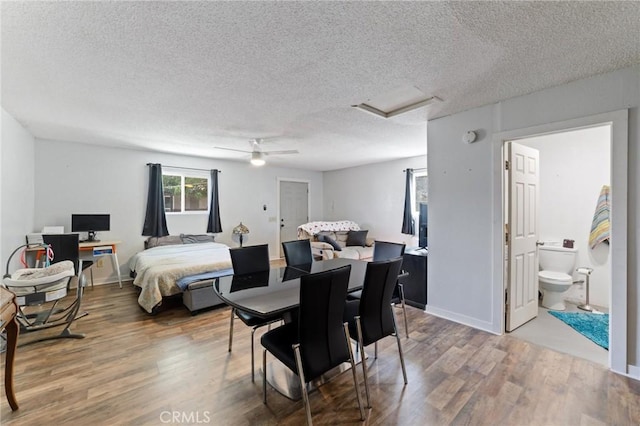 14650 Harding St, Hesperia, CA 92345 - bedroom with attic access, wood finished floors, a textured ceiling, a ceiling fan, and baseboards