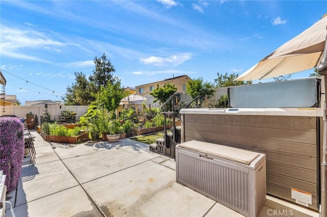 1316 Bannock St, Beaumont, CA 92223 - fenced backyard featuring a vegetable garden and a patio area