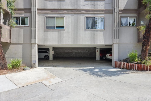155 Rosebay Dr Unit 42, Encinitas, CA 92024 - view of side of home with concrete driveway and an attached garage