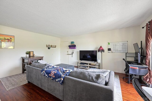 155 Rosebay Dr Unit 42, Encinitas, CA 92024 - living room featuring wood finished floors, a textured ceiling, and baseboards