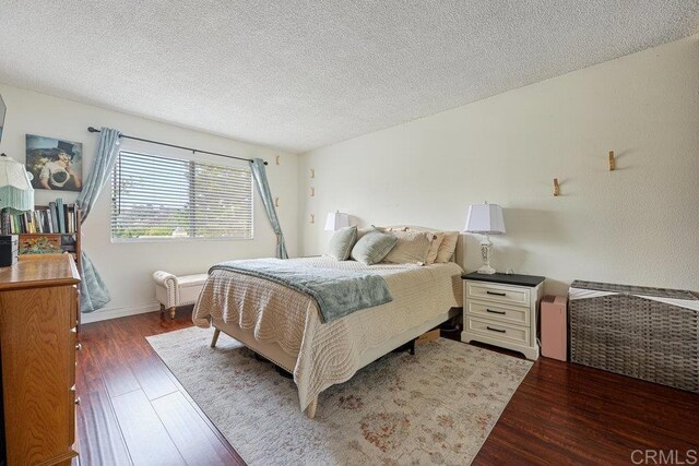155 Rosebay Dr Unit 42, Encinitas, CA 92024 - bedroom with wood finished floors and a textured ceiling
