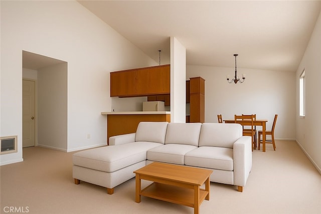 6188 Agee St Unit 230, San Diego, CA 92122 - living area with lofted ceiling, a chandelier, and light carpet