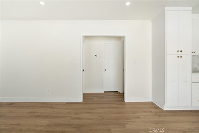 1027 E 10th St, Long Beach, CA 90813 - empty room with recessed lighting, light wood-type flooring, and baseboards