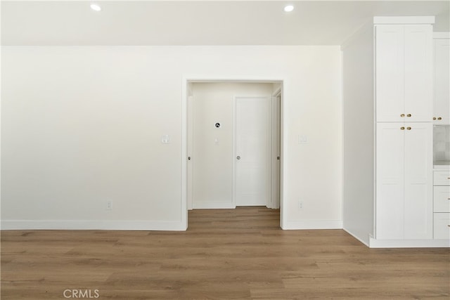 1027 E 10th St, Long Beach, CA 90813 - empty room with recessed lighting and light wood-style flooring