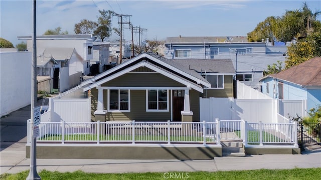 1027 E 10th St, Long Beach, CA 90813 - view of front of house with a fenced front yard and a porch