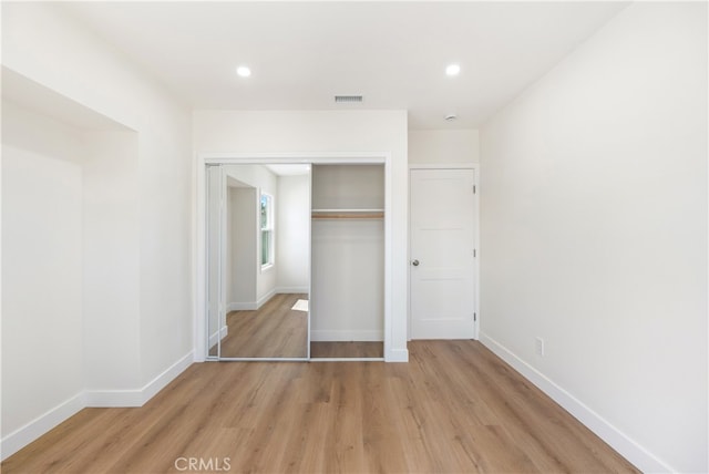 1027 E 10th St, Long Beach, CA 90813 - unfurnished bedroom with light wood-type flooring, baseboards, a closet, and recessed lighting