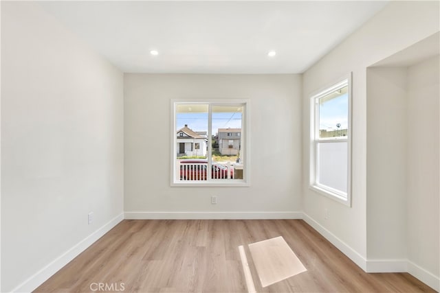 1027 E 10th St, Long Beach, CA 90813 - spare room with light wood-type flooring, plenty of natural light, baseboards, and recessed lighting