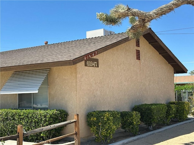 61947 Plaza Rd, Joshua Tree, CA 92252 - view of property exterior with stucco siding