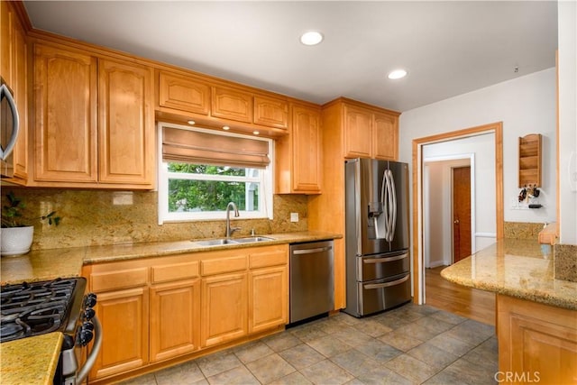 16243 Lisco St, Whittier, CA 90603 - kitchen with stainless steel appliances, a sink, backsplash, light stone countertops, and recessed lighting