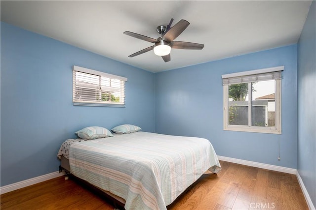 16243 Lisco St, Whittier, CA 90603 - bedroom with baseboards, wood finished floors, and multiple windows