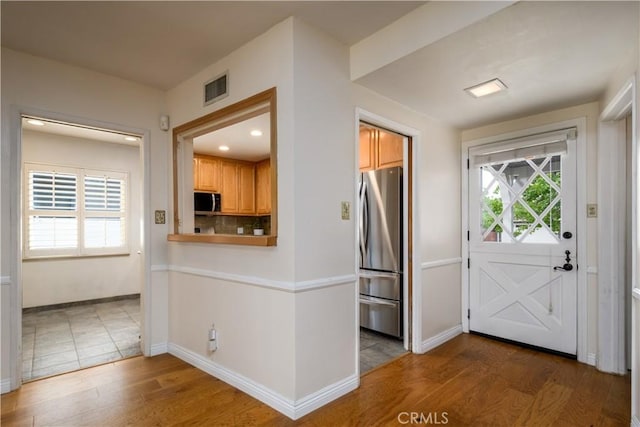 16243 Lisco St, Whittier, CA 90603 - kitchen featuring stainless steel appliances, wood finished floors, baseboards, recessed lighting, and decorative backsplash