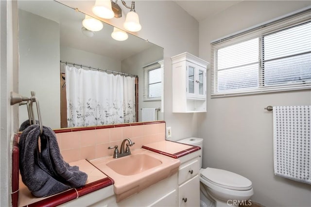 16243 Lisco St, Whittier, CA 90603 - full bath with toilet, vanity, and tasteful backsplash