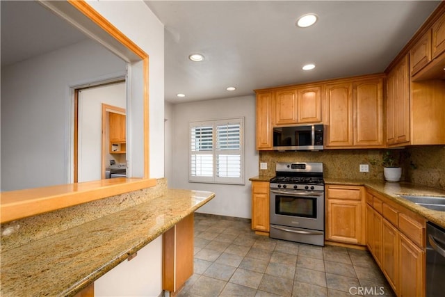 16243 Lisco St, Whittier, CA 90603 - kitchen with stainless steel appliances, backsplash, recessed lighting, and light stone countertops