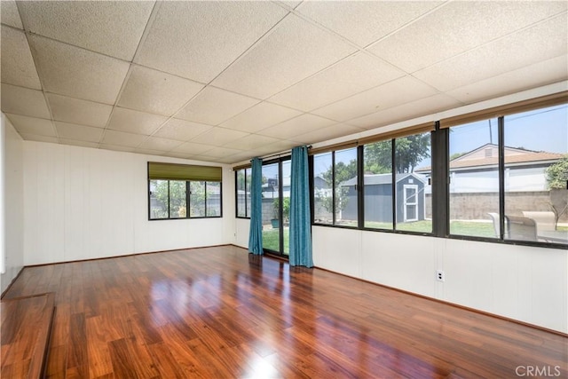 16243 Lisco St, Whittier, CA 90603 - empty room with wood finished floors and a drop ceiling