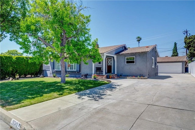 16243 Lisco St, Whittier, CA 90603 - view of front of house featuring stucco siding, an outbuilding, a front yard, and a garage