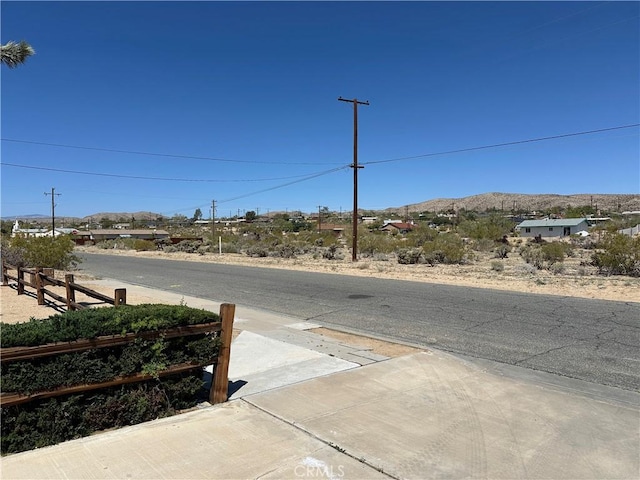 61959 Plaza Rd, Joshua Tree, CA 92252 - view of asphalt road featuring a mountain view