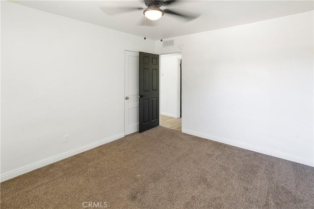 1212 Woodrow Ave, Bakersfield, CA 93308 - unfurnished room with light carpet, ceiling fan, and baseboards