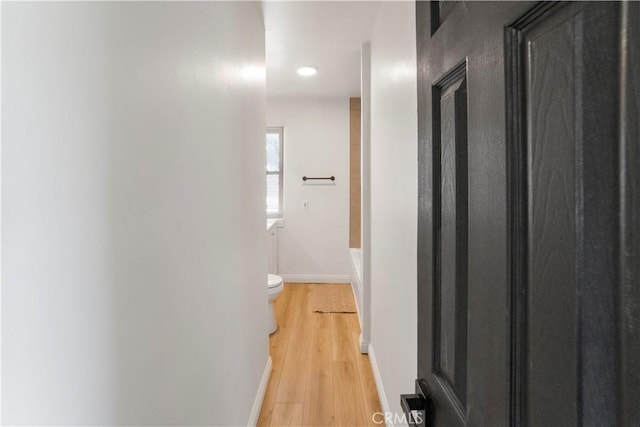 1212 Woodrow Ave, Bakersfield, CA 93308 - corridor featuring light wood-style flooring, baseboards, and recessed lighting
