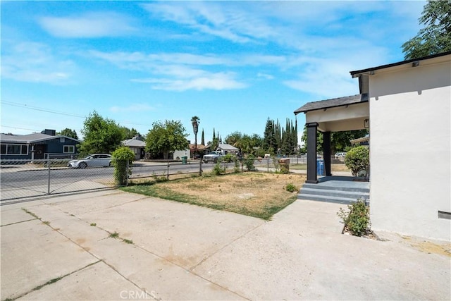 1212 Woodrow Ave, Bakersfield, CA 93308 - view of yard with driveway and a gate