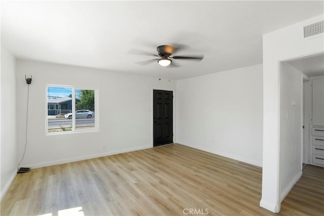 1212 Woodrow Ave, Bakersfield, CA 93308 - empty room with light wood-type flooring, a ceiling fan, and baseboards