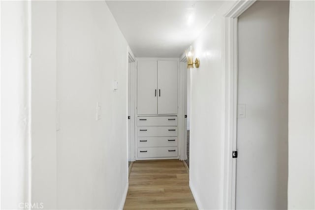 1212 Woodrow Ave, Bakersfield, CA 93308 - hallway with light wood finished floors and baseboards