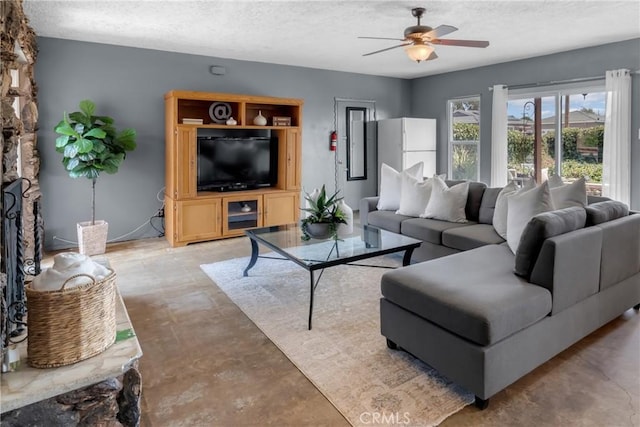 7860 La Fiesta Dr, Buena Park, CA 90620 - living area with finished concrete floors, ceiling fan, and a textured ceiling