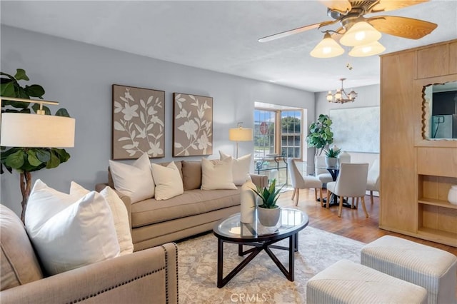 7860 La Fiesta Dr, Buena Park, CA 90620 - living area featuring a chandelier, light wood-style floors, and a ceiling fan