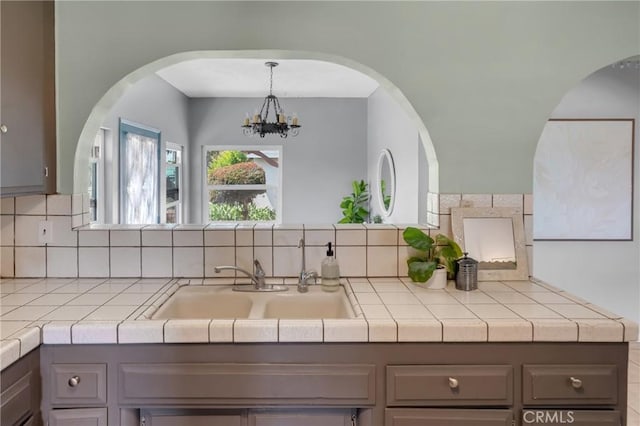 7860 La Fiesta Dr, Buena Park, CA 90620 - kitchen featuring gray cabinetry and backsplash