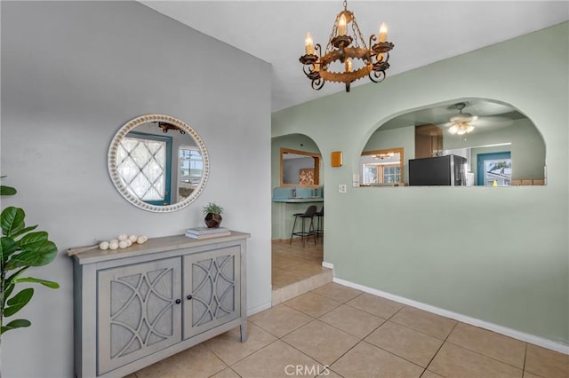 7860 La Fiesta Dr, Buena Park, CA 90620 - hall with a chandelier, arched walkways, tile patterned floors, and baseboards