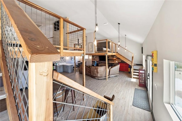 64952 Twentynine Palms Hwy, Joshua Tree, CA 92252 - stairway featuring wood finished floors and high vaulted ceiling