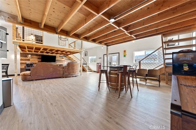 64952 Twentynine Palms Hwy, Joshua Tree, CA 92252 - dining room with stairway, healthy amount of natural light, wood finished floors, and wooden ceiling with exposed beams