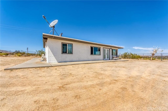 64952 Twentynine Palms Hwy, Joshua Tree, CA 92252 - rear view of property featuring french doors, stucco siding, and a patio area