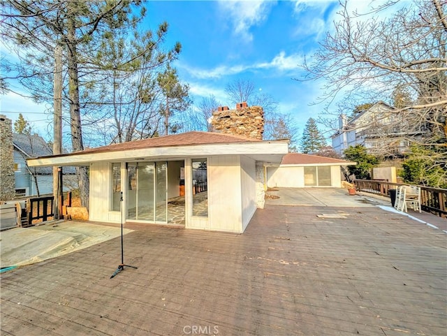 485 State Highway 173, Lake Arrowhead, CA 92352 - back of house featuring a wooden deck and a chimney