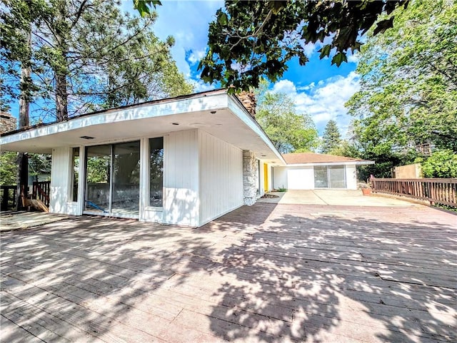 485 State Highway 173, Lake Arrowhead, CA 92352 - back of property featuring a wooden deck and concrete driveway