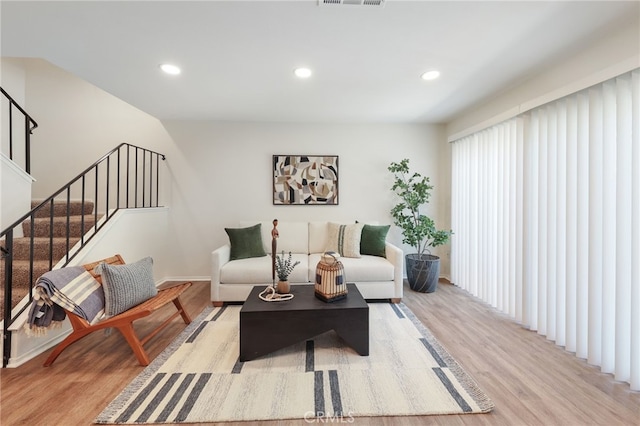 1634 Iowa St Unit B, Costa Mesa, CA 92626 - living area with light wood finished floors, stairway, recessed lighting, and baseboards