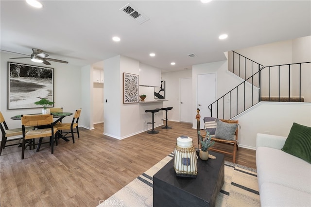 1634 Iowa St Unit B, Costa Mesa, CA 92626 - living room featuring wood finished floors, stairs, baseboards, ceiling fan, and recessed lighting