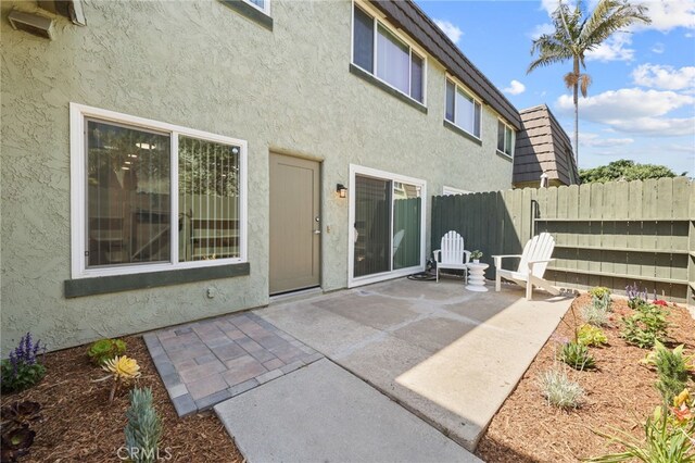 1634 Iowa St Unit B, Costa Mesa, CA 92626 - rear view of property with stucco siding and a patio