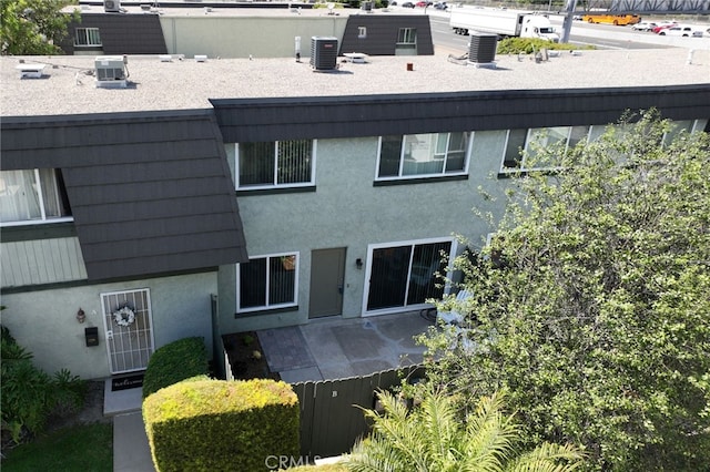 1634 Iowa St Unit B, Costa Mesa, CA 92626 - back of property with stucco siding and central AC unit