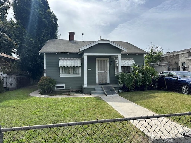 342 W 76th St, Los Angeles, CA 90003 - bungalow-style home featuring a chimney and a shingled roof