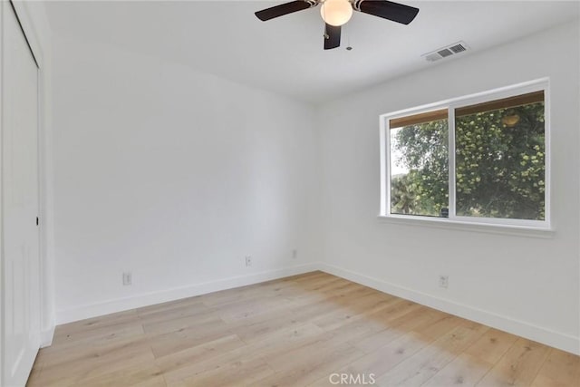 4426 Oil Well Rd, Phelan, CA 92371 - unfurnished room with light wood finished floors, baseboards, and a ceiling fan