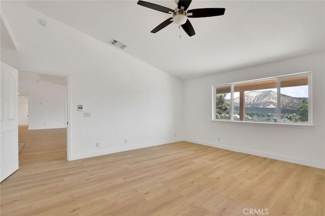 4426 Oil Well Rd, Phelan, CA 92371 - spare room with ceiling fan, light wood finished floors, vaulted ceiling, and baseboards