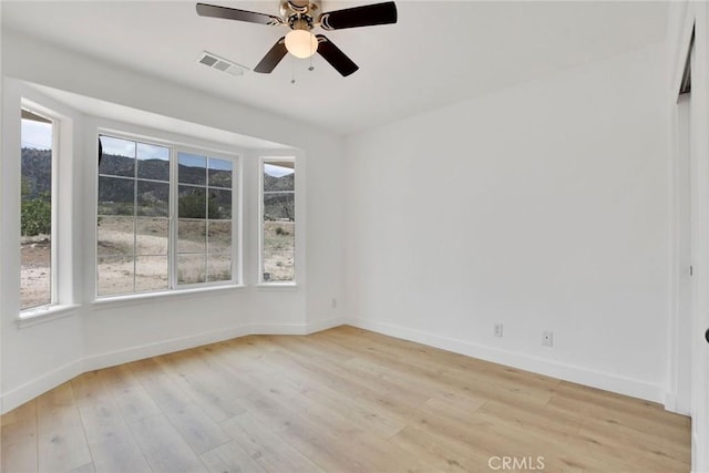 4426 Oil Well Rd, Phelan, CA 92371 - spare room featuring light wood-type flooring, a ceiling fan, and baseboards