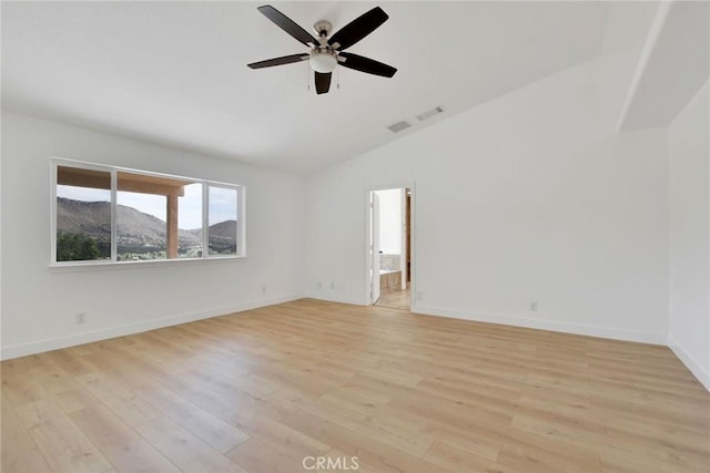 4426 Oil Well Rd, Phelan, CA 92371 - empty room featuring lofted ceiling, light wood-type flooring, a ceiling fan, baseboards, and a mountain view