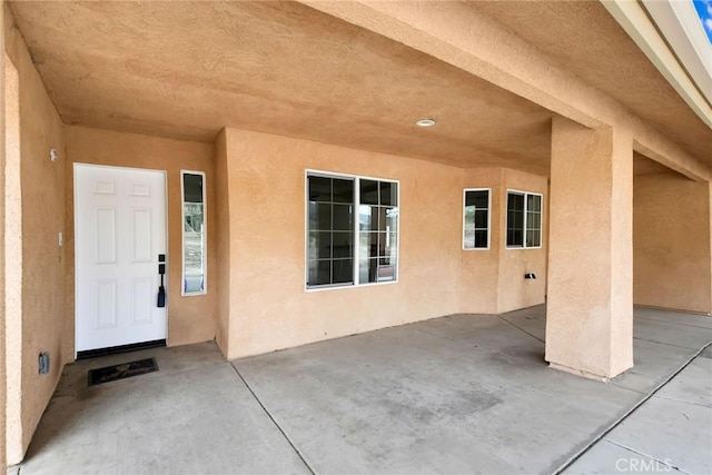 4426 Oil Well Rd, Phelan, CA 92371 - entrance to property with stucco siding and a patio area