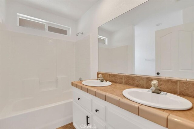4426 Oil Well Rd, Phelan, CA 92371 - full bathroom with double vanity and shower / washtub combination
