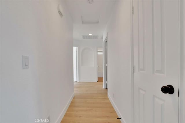 4426 Oil Well Rd, Phelan, CA 92371 - hallway with light wood finished floors, baseboards, and attic access