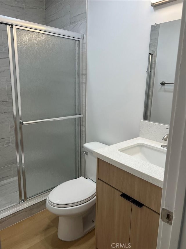 14805 Chase St Unit 224, Panorama City, CA 91402 - full bath featuring vanity, toilet, a shower stall, and wood finished floors