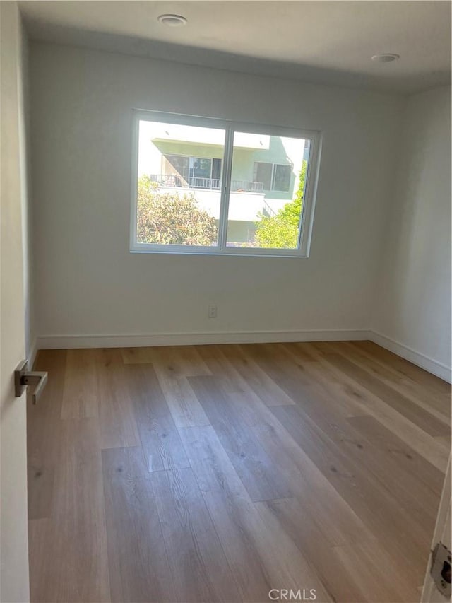 14805 Chase St Unit 224, Panorama City, CA 91402 - unfurnished room with wood finished floors and baseboards