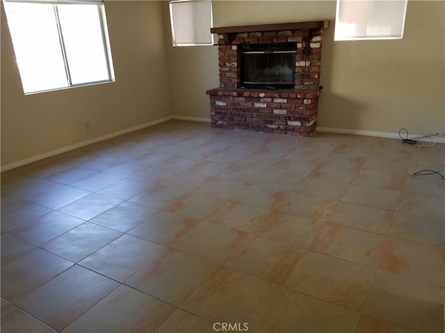 29039 Eveningside Dr, Castaic, CA 91384 - unfurnished living room with a fireplace, baseboards, and tile patterned floors