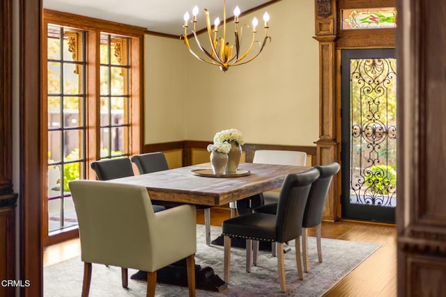 10484 Creek Rd, Oak View, CA 93022 - dining room with a chandelier, wood finished floors, and a wainscoted wall